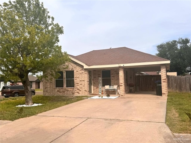 9216 N 31st St, Mcallen, TX 78504 - single story home with concrete driveway, brick siding, and a carport