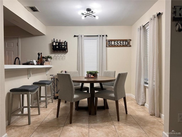 9216 N 31st St, Mcallen, TX 78504 - dining room featuring light tile patterned floors and a chandelier