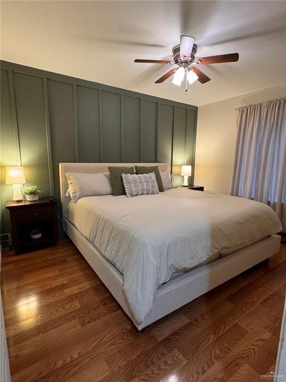 9216 N 31st St, Mcallen, TX 78504 - bedroom featuring a decorative wall, dark wood-type flooring, and a ceiling fan