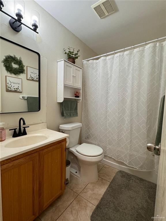 9216 N 31st St, Mcallen, TX 78504 - bathroom with tile patterned flooring and vanity