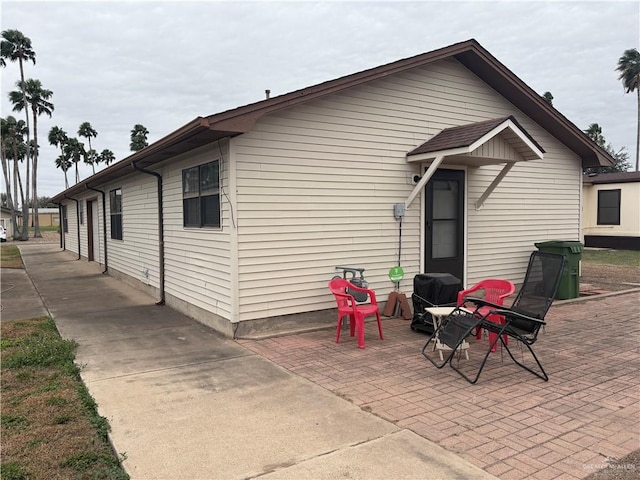 rear view of house featuring a patio