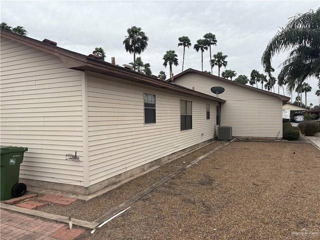 view of side of property featuring central AC unit