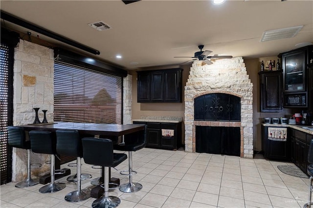 kitchen with ceiling fan and light tile patterned flooring