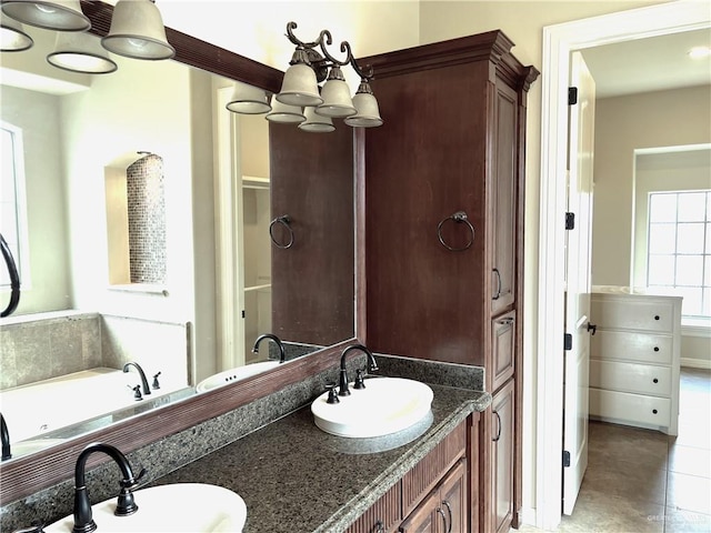 bathroom with tile patterned flooring and vanity