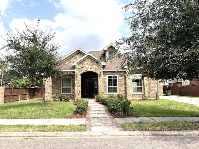 craftsman-style home featuring a front lawn