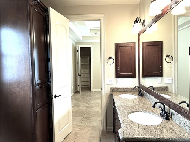 bathroom with tile patterned flooring and vanity