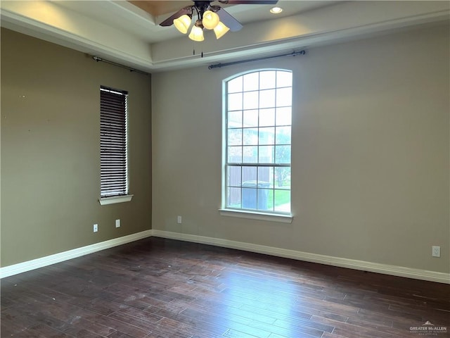 unfurnished room featuring ceiling fan and dark hardwood / wood-style floors