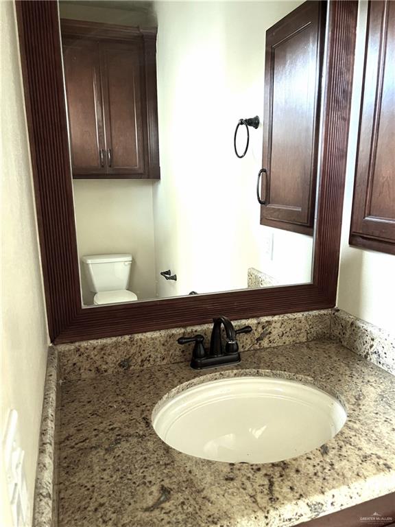 bathroom with vanity and toilet