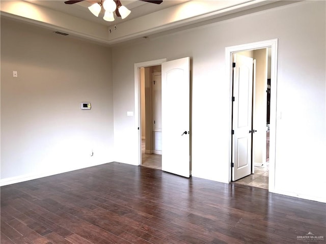 empty room featuring hardwood / wood-style flooring and ceiling fan