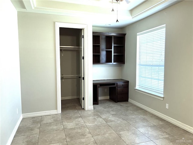 unfurnished bedroom featuring light tile patterned floors and ceiling fan