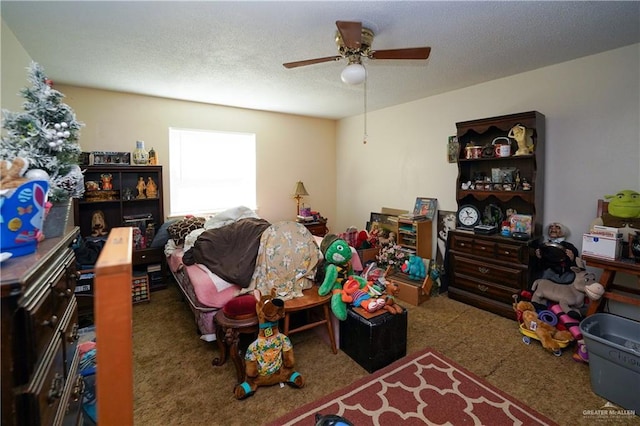 603 S Alamo Rd, Alamo, TX 78516 - carpeted bedroom with a ceiling fan and a textured ceiling