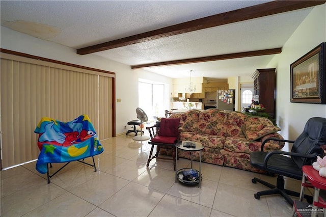 603 S Alamo Rd, Alamo, TX 78516 - living area with light tile patterned floors, beamed ceiling, a textured ceiling, and a notable chandelier