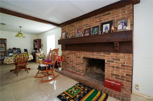 603 S Alamo Rd, Alamo, TX 78516 - living area featuring tile patterned floors, a fireplace, a textured ceiling, and beam ceiling