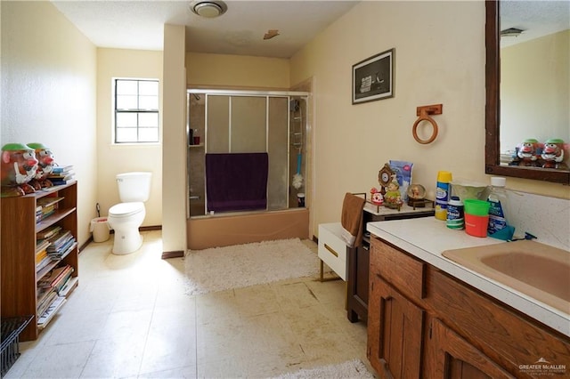 603 S Alamo Rd, Alamo, TX 78516 - full bathroom featuring toilet, tile patterned floors, shower / bath combination with glass door, and vanity