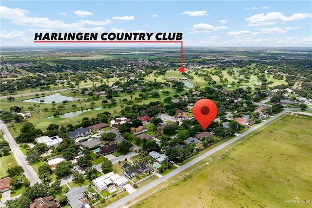 524 Palm Valley Dr E, Harlingen, TX 78552 - aerial perspective of suburban area featuring a large body of water