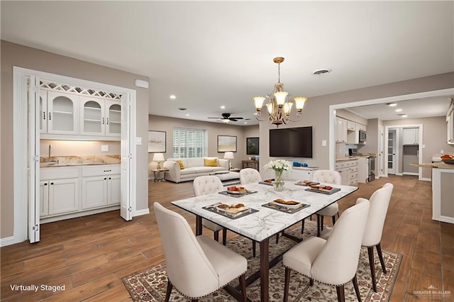 524 Palm Valley Dr E, Harlingen, TX 78552 - dining space featuring a chandelier, dark wood finished floors, recessed lighting, and baseboards