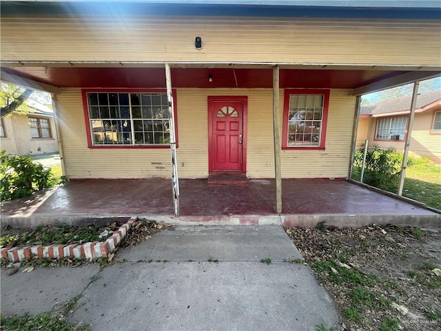 doorway to property featuring a porch