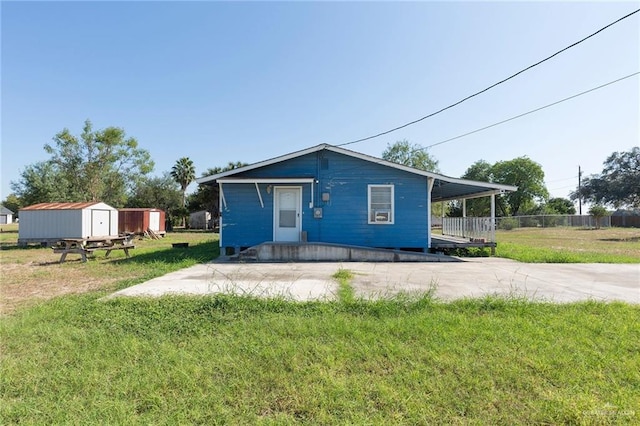 406 S Ave E, Donna, TX 78537 - bungalow-style house featuring a shed and an outbuilding