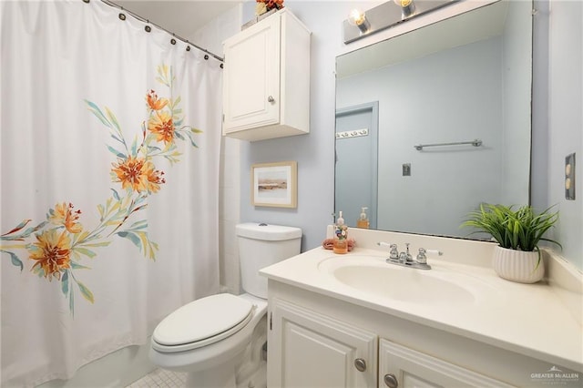 bathroom featuring walk in shower, vanity, and toilet