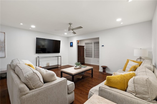 living room with dark hardwood / wood-style floors and ceiling fan