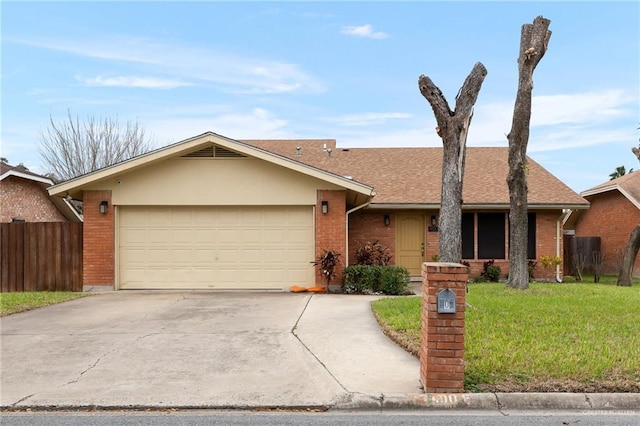 single story home with a garage and a front lawn