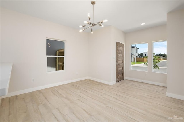 2510 E Solar Dr, Mission, TX 78574 - spare room featuring a chandelier, wood finished floors, and recessed lighting