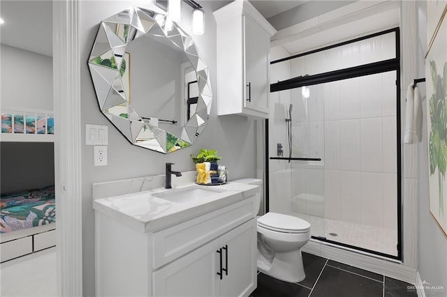 102 E Whiting St Unit A & B, South Padre Island, TX 78597 - ensuite bathroom featuring vanity, a stall shower, toilet, and tile patterned flooring