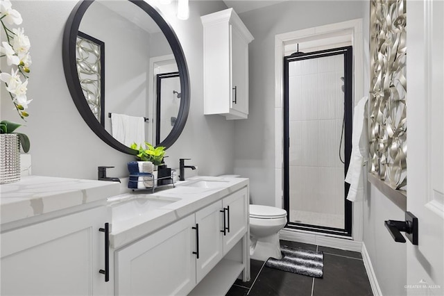 102 E Whiting St Unit A & B, South Padre Island, TX 78597 - full bathroom featuring toilet, a shower stall, double vanity, and tile patterned floors
