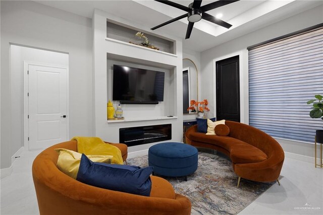 102 E Whiting St Unit A & B, South Padre Island, TX 78597 - living area featuring a ceiling fan, baseboards, and a glass covered fireplace