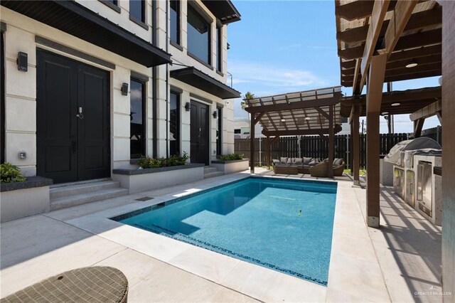 102 E Whiting St Unit A & B, South Padre Island, TX 78597 - view of swimming pool with an outdoor living space, a pergola, a patio, entry steps, and area for grilling