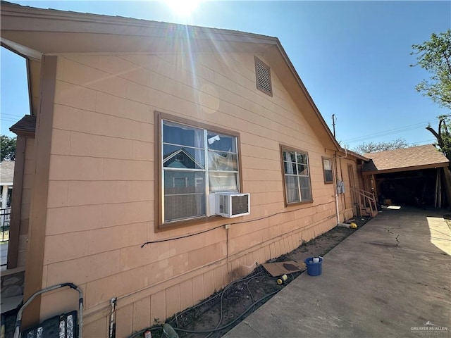 view of home's exterior with cooling unit