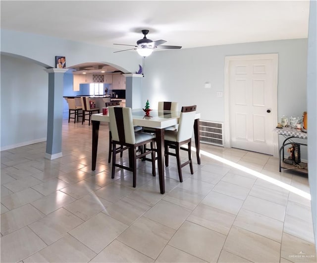 tiled dining area with ceiling fan