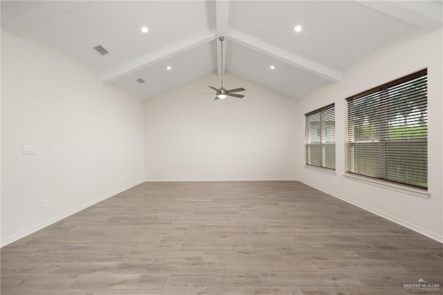 empty room with vaulted ceiling with beams, ceiling fan, and light hardwood / wood-style flooring