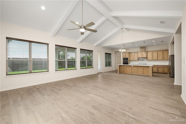 unfurnished living room featuring ceiling fan with notable chandelier, light wood-type flooring, high vaulted ceiling, and beamed ceiling