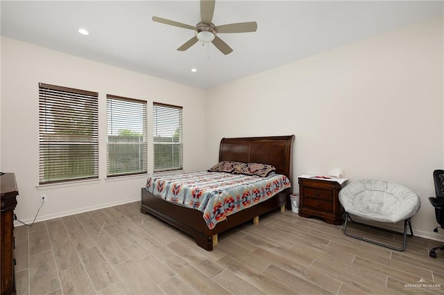 bedroom featuring ceiling fan and light hardwood / wood-style flooring