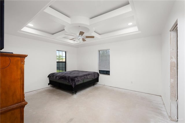 bedroom with a raised ceiling, ceiling fan, and coffered ceiling