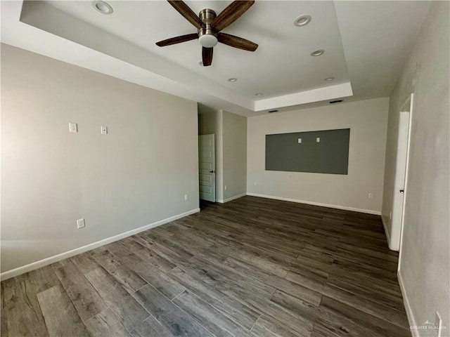 8706 Pink Flamingo St, Harlingen, TX 78552 - unfurnished room featuring a tray ceiling, ceiling fan, recessed lighting, wood finished floors, and baseboards