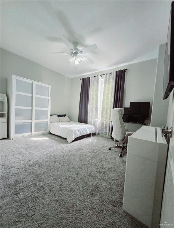 carpeted bedroom with ceiling fan