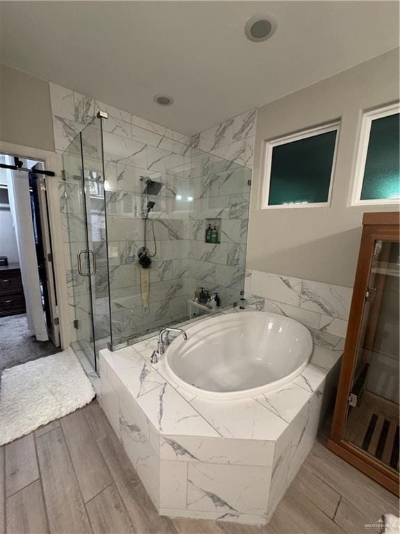 bathroom with shower with separate bathtub