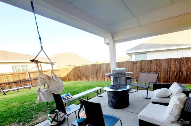 view of patio / terrace featuring an outdoor living space with a fire pit, a fenced backyard, and a grill