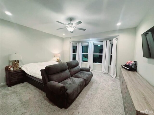 kitchen with white cabinets, appliances with stainless steel finishes, an island with sink, decorative backsplash, and a breakfast bar