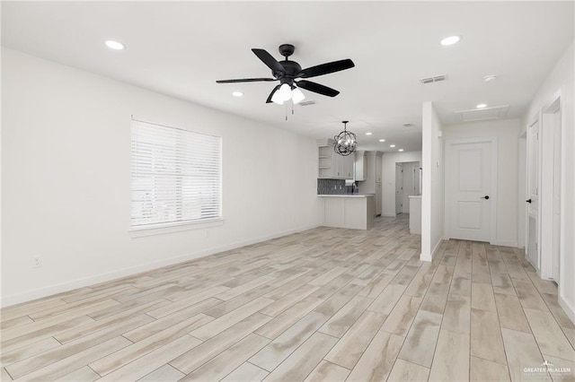 321 E Stubbs St, Edinburg, TX 78539 - unfurnished living room with recessed lighting, light wood finished floors, and a ceiling fan