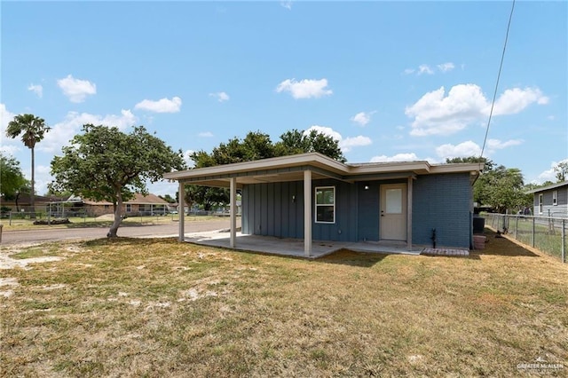 321 E Stubbs St, Edinburg, TX 78539 - back of property with board and batten siding and a carport