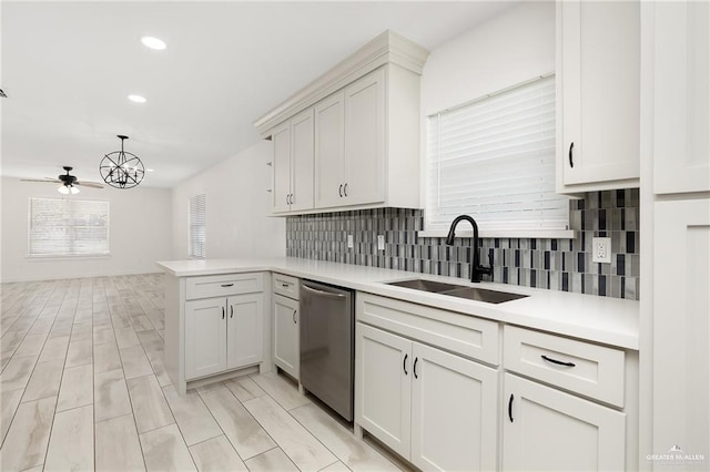 321 E Stubbs St, Edinburg, TX 78539 - kitchen with dishwasher, a peninsula, light countertops, tasteful backsplash, and recessed lighting