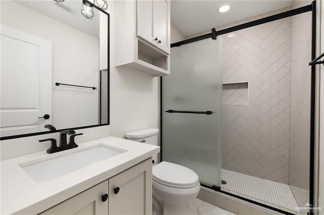 321 E Stubbs St, Edinburg, TX 78539 - bathroom with vanity, a stall shower, and recessed lighting