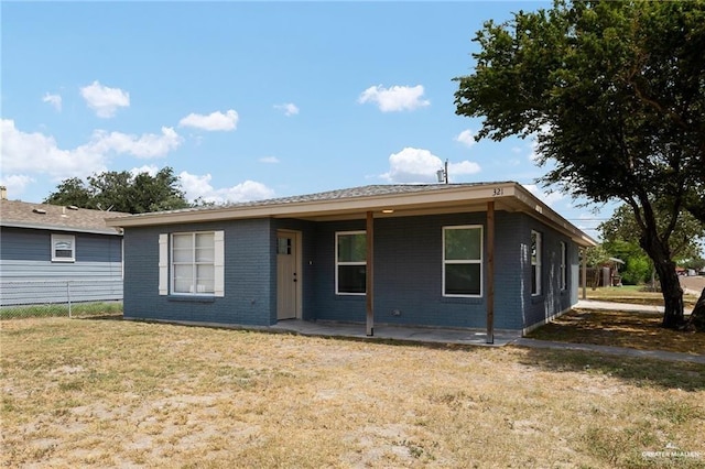 321 E Stubbs St, Edinburg, TX 78539 - view of front of property with a front yard and brick siding