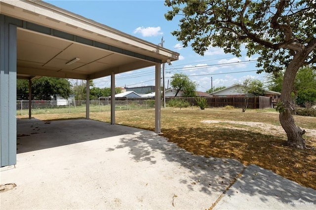 321 E Stubbs St, Edinburg, TX 78539 - view of patio with a carport and concrete driveway