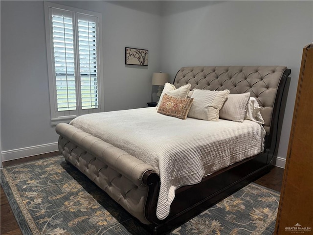 bedroom featuring dark hardwood / wood-style flooring