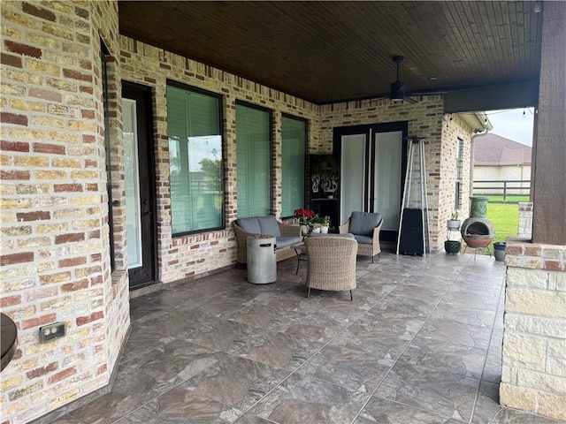 view of patio / terrace featuring ceiling fan