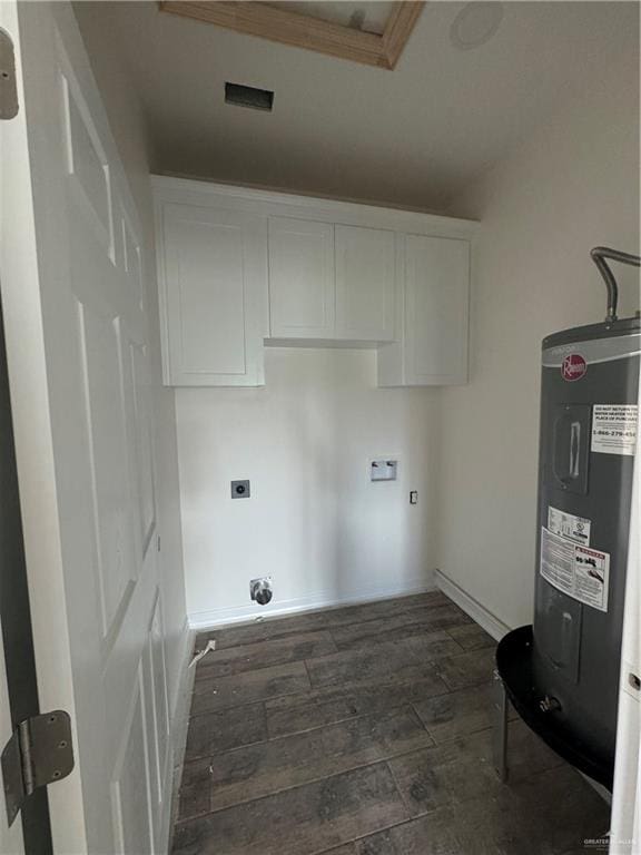 clothes washing area featuring electric dryer hookup, cabinets, electric water heater, washer hookup, and dark hardwood / wood-style flooring